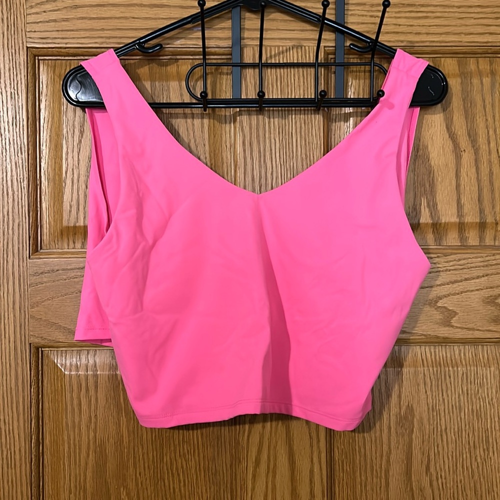 Hot pink workout tank top size XL, light/medium support. No stains or tears.